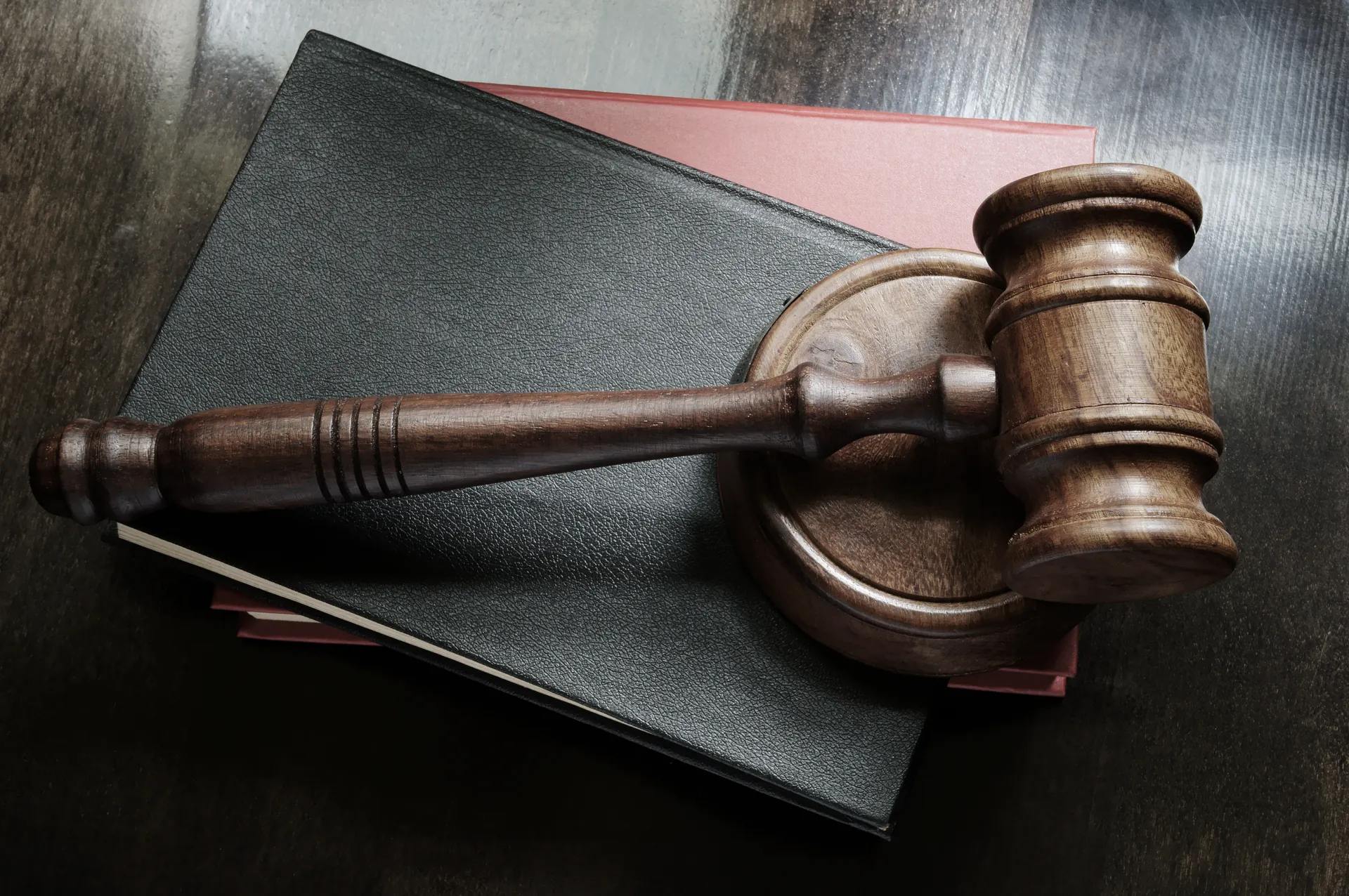 Gavel on a desk beside papers